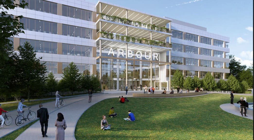 Modern Arbour building near SHAPINS Clinic | Reading, England, GB with people and bicycles.