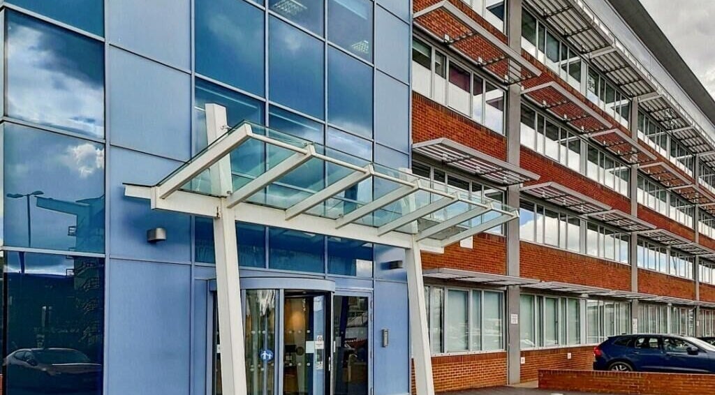 Exterior view of SHAPINS Clinic | Crawley showcasing modern glass facade in Crawley, England, GB.