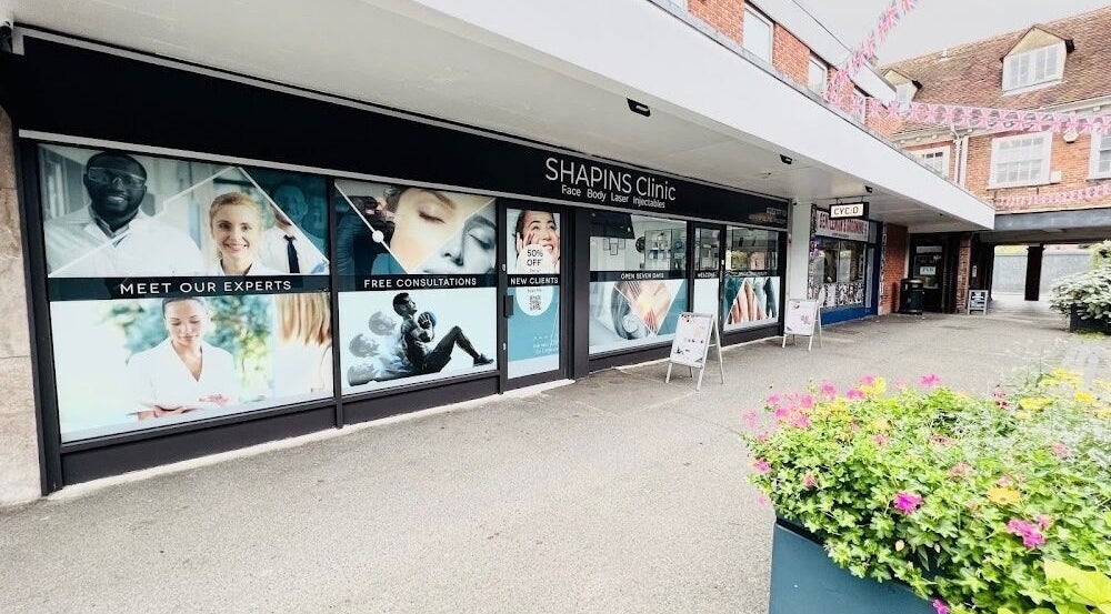 Front view of SHAPINS Clinic Farnham, showcasing modern design at Farnham, England, GB with vibrant floral decor.