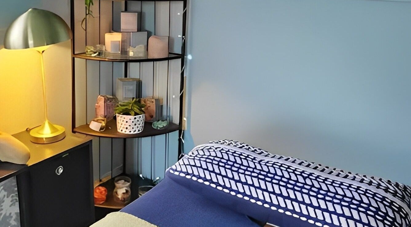 Cozy wellness space at Holistic Shed with Laura Kirk in Matlock, England, GB, featuring a soft lit lamp and decor.