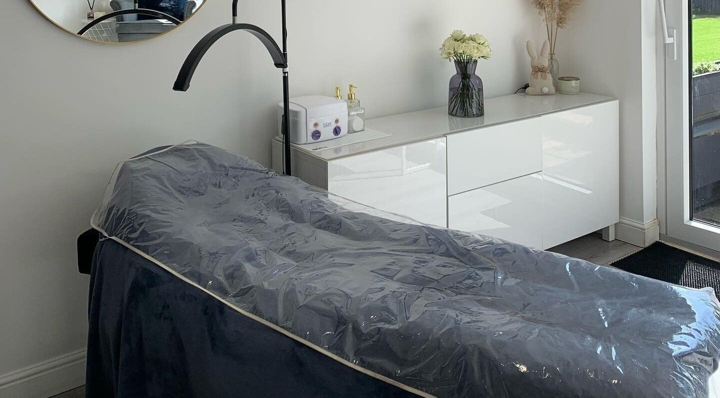 Elegant spa room at Evoke Beauty, Clophill, England, GB, featuring a cozy treatment bed.