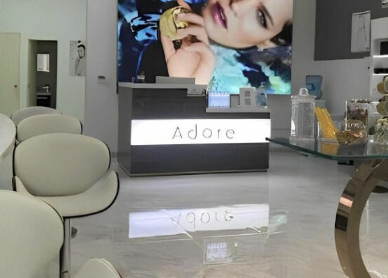 Sophisticated interior of Adore Medispa in Cancún, Quintana Roo, MX with elegant décor and modern seating.