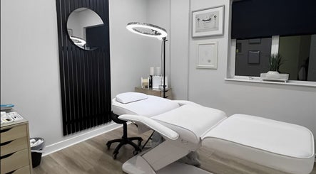Modern treatment room at Loren Dermody PhiBrows, Carlow, County Carlow, IE with sleek white furniture and decor.