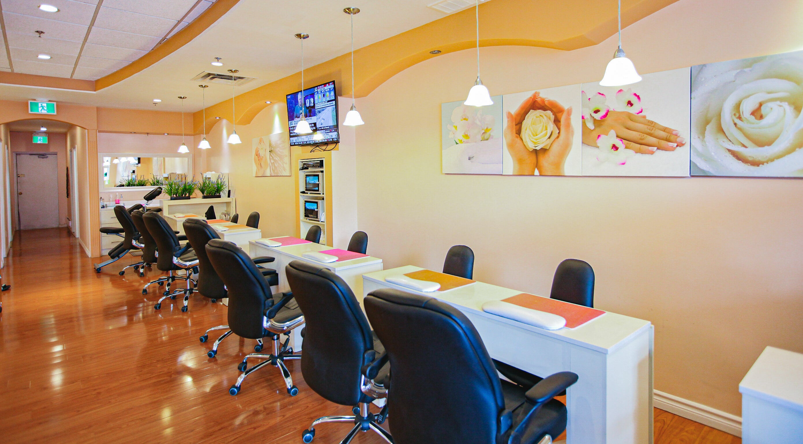 Interior of Pinky Nails and Spa on Davisville showcasing stylish manicure stations in Toronto, Ontario, CA.