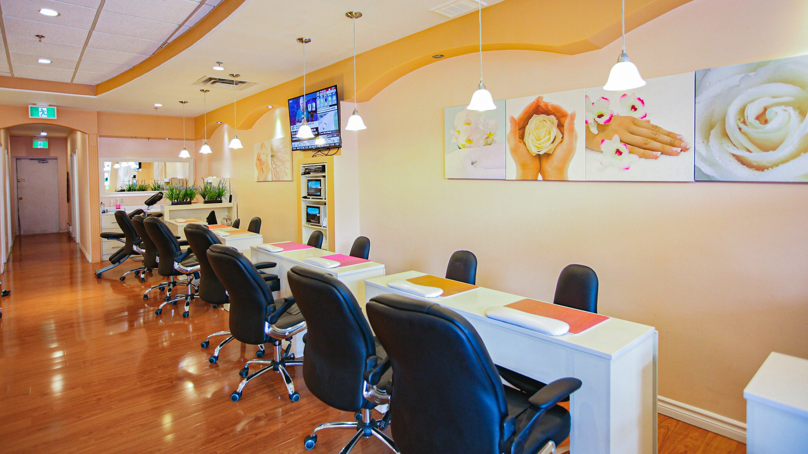 Interior of Pinky Nails and Spa on Davisville showcasing stylish manicure stations in Toronto, Ontario, CA.