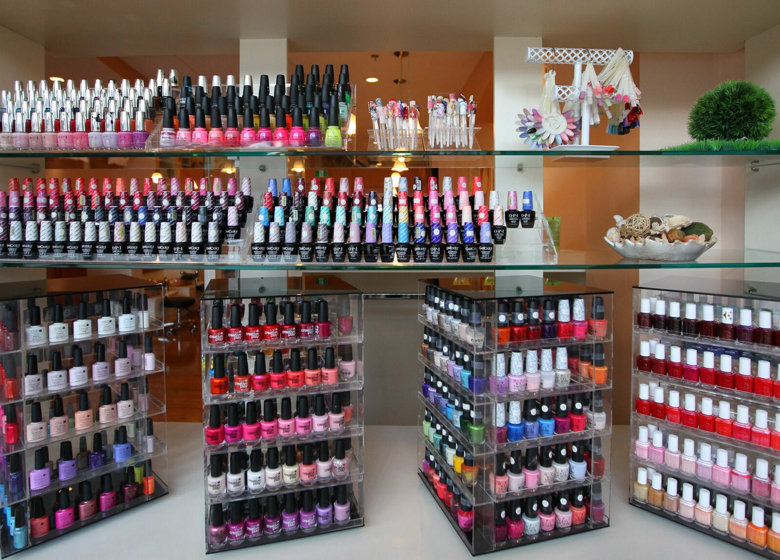 Colorful nail polish display at Pinky Nails and Spa on Davisville in Toronto, Ontario, CA.