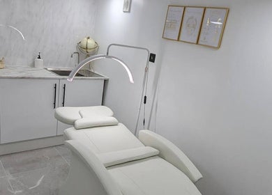 Relaxing spa room at Joanne Louise Hair And Beauty, Acle, England, GB with a plush treatment bed.