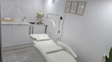 Relaxing spa room at Joanne Louise Hair And Beauty, Acle, England, GB with a plush treatment bed.