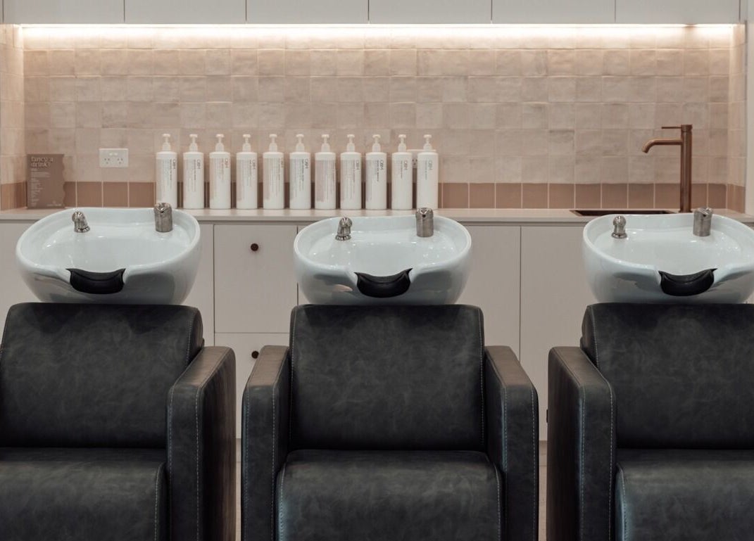 Stylish salon wash stations at Glam Theory Studios, Heathmont, Victoria, AU, offer a relaxing hair care experience.
