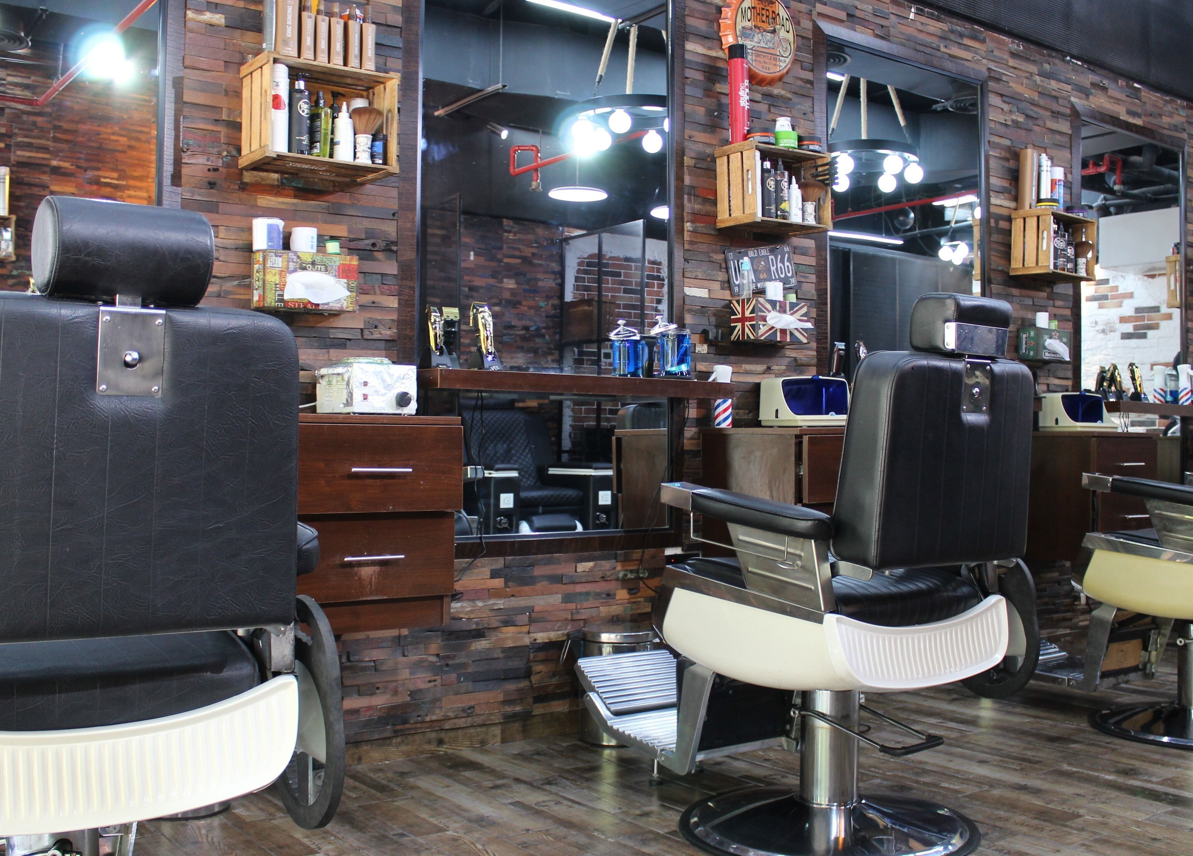 Modern barber chairs in Tornado Gents Salon - JLT, located in Dubai, Dubai, AE. Stylish and welcoming interior.