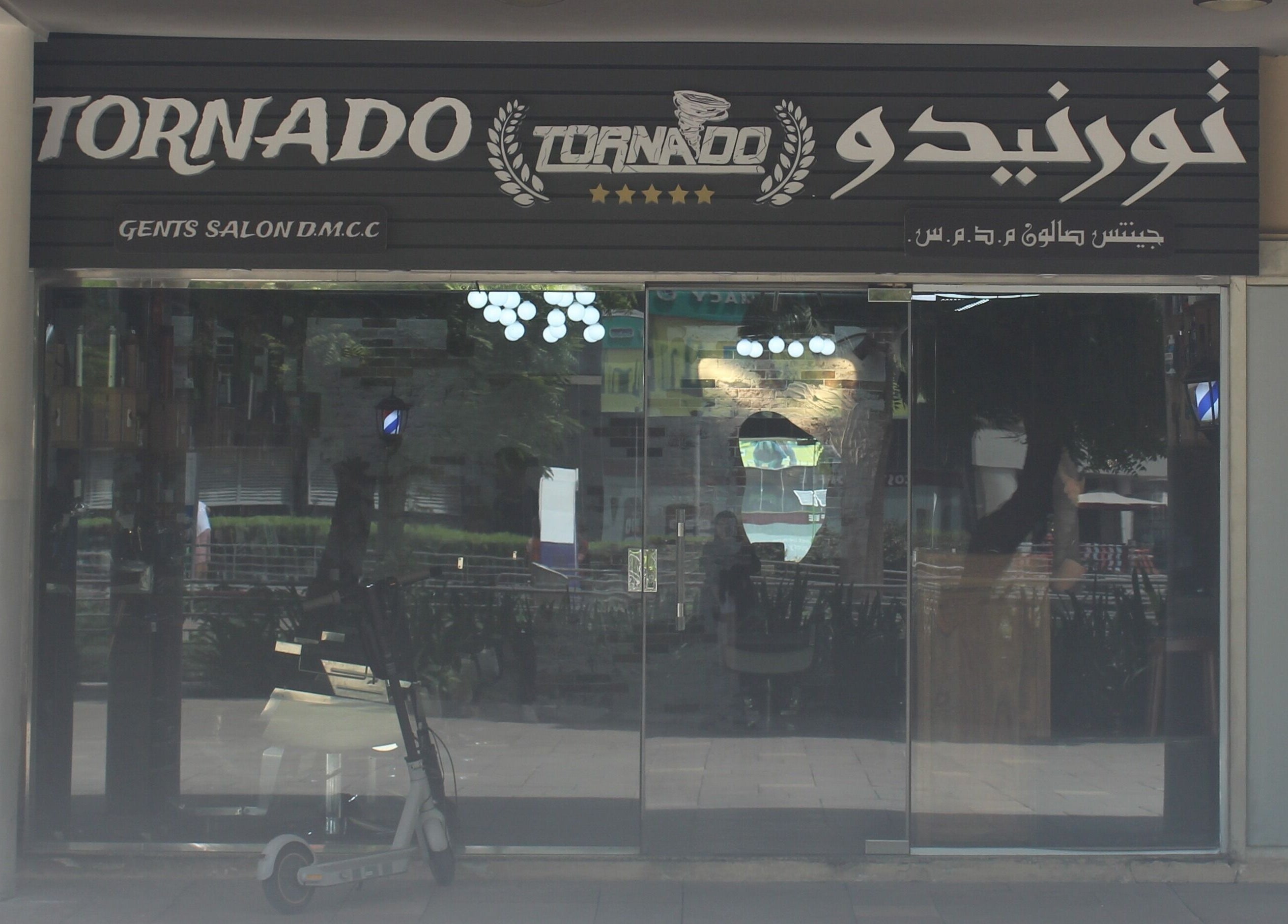 Tornado Gents Salon - JLT entrance in Dubai, Dubai, AE with stylish glass doors and signage.