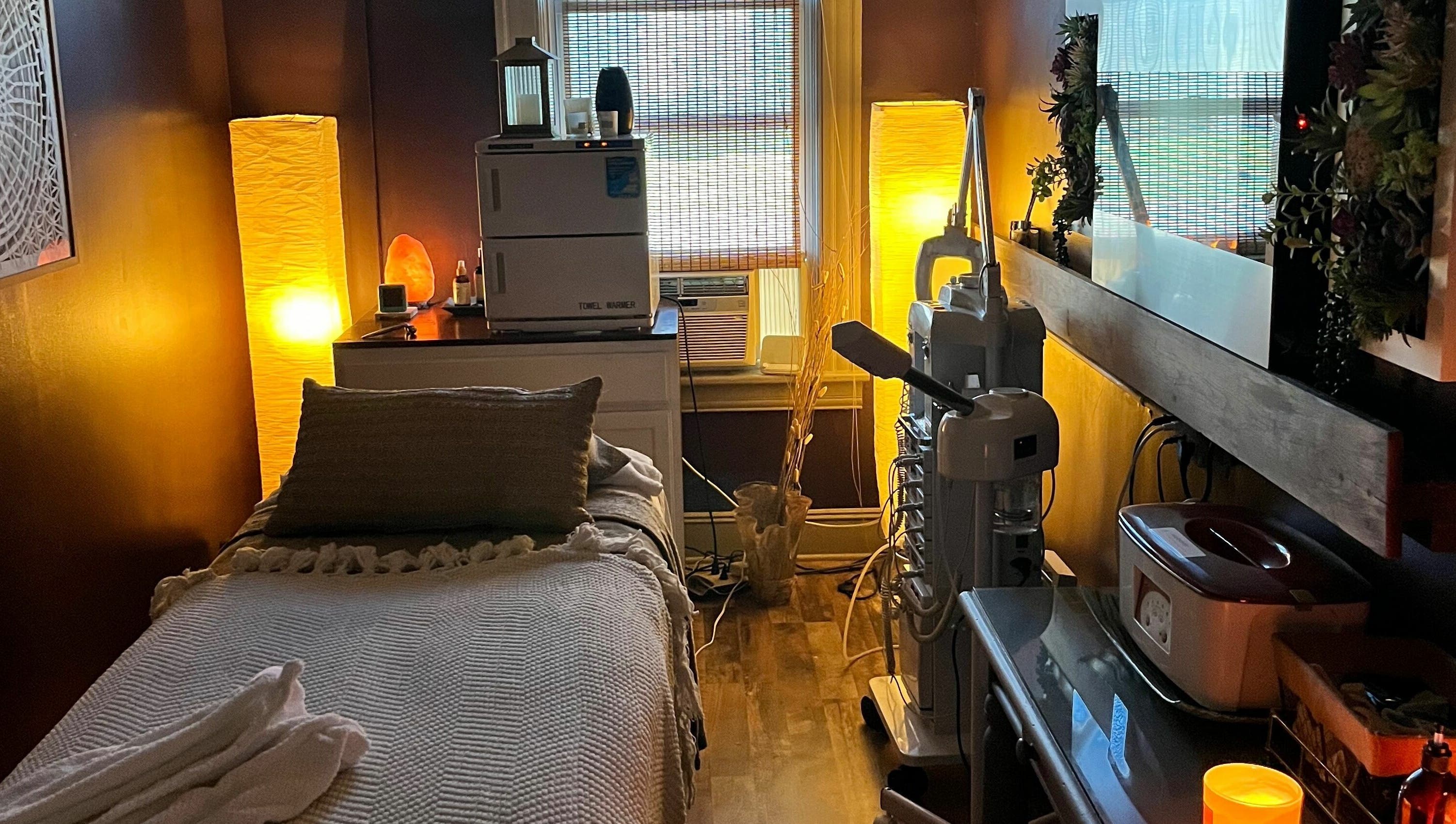 Tranquil massage room at Robert Joseph's Salon, Syracuse, New York, US. Warm lighting and cozy ambiance.