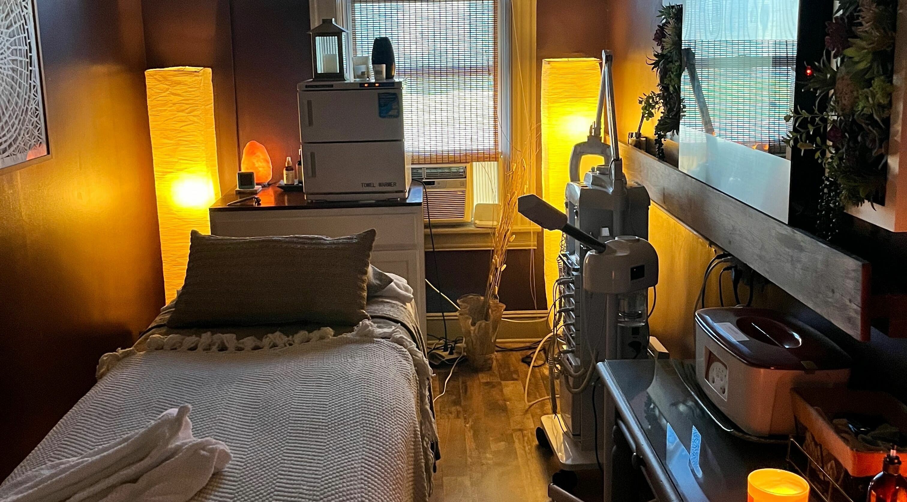 Tranquil massage room at Robert Joseph's Salon, Syracuse, New York, US. Warm lighting and cozy ambiance.