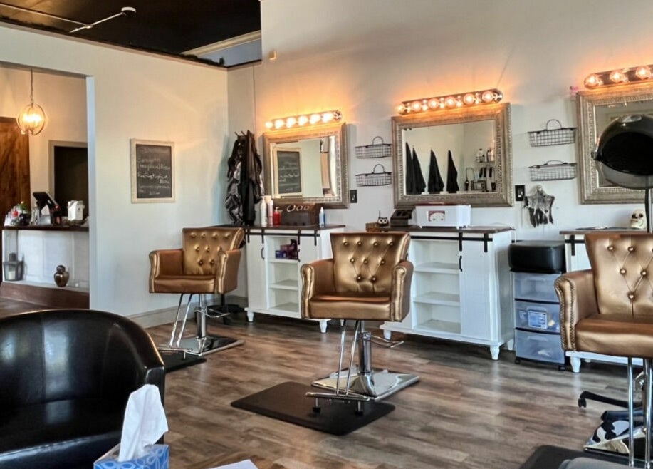 Luxurious interior of Robert Joseph's Salon in Syracuse, New York, US showcasing elegant styling chairs and mirrors.