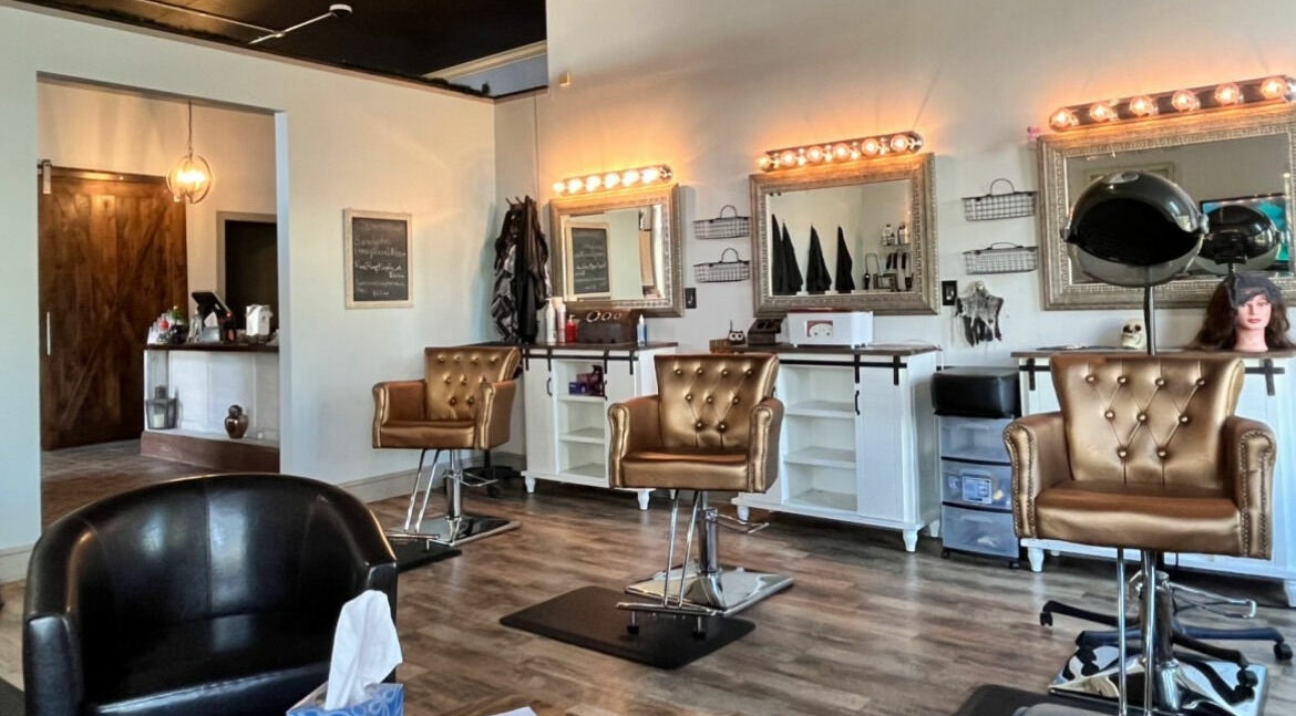 Luxurious interior of Robert Joseph's Salon in Syracuse, New York, US showcasing elegant styling chairs and mirrors.
