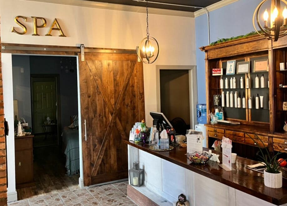 Reception area of Robert Joseph's Salon in Syracuse, New York, US with wooden decor and spa signage.