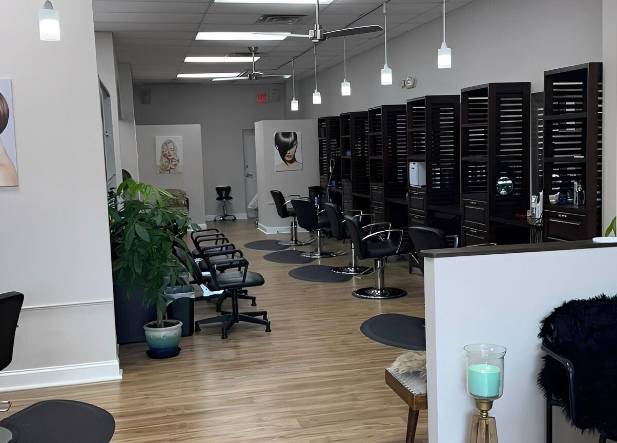 Chic salon interior at Studio 3 in Naples, Florida, US featuring modern styling stations and decor.