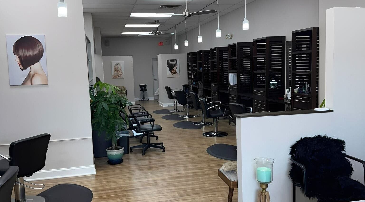 Chic salon interior at Studio 3 in Naples, Florida, US featuring modern styling stations and decor.