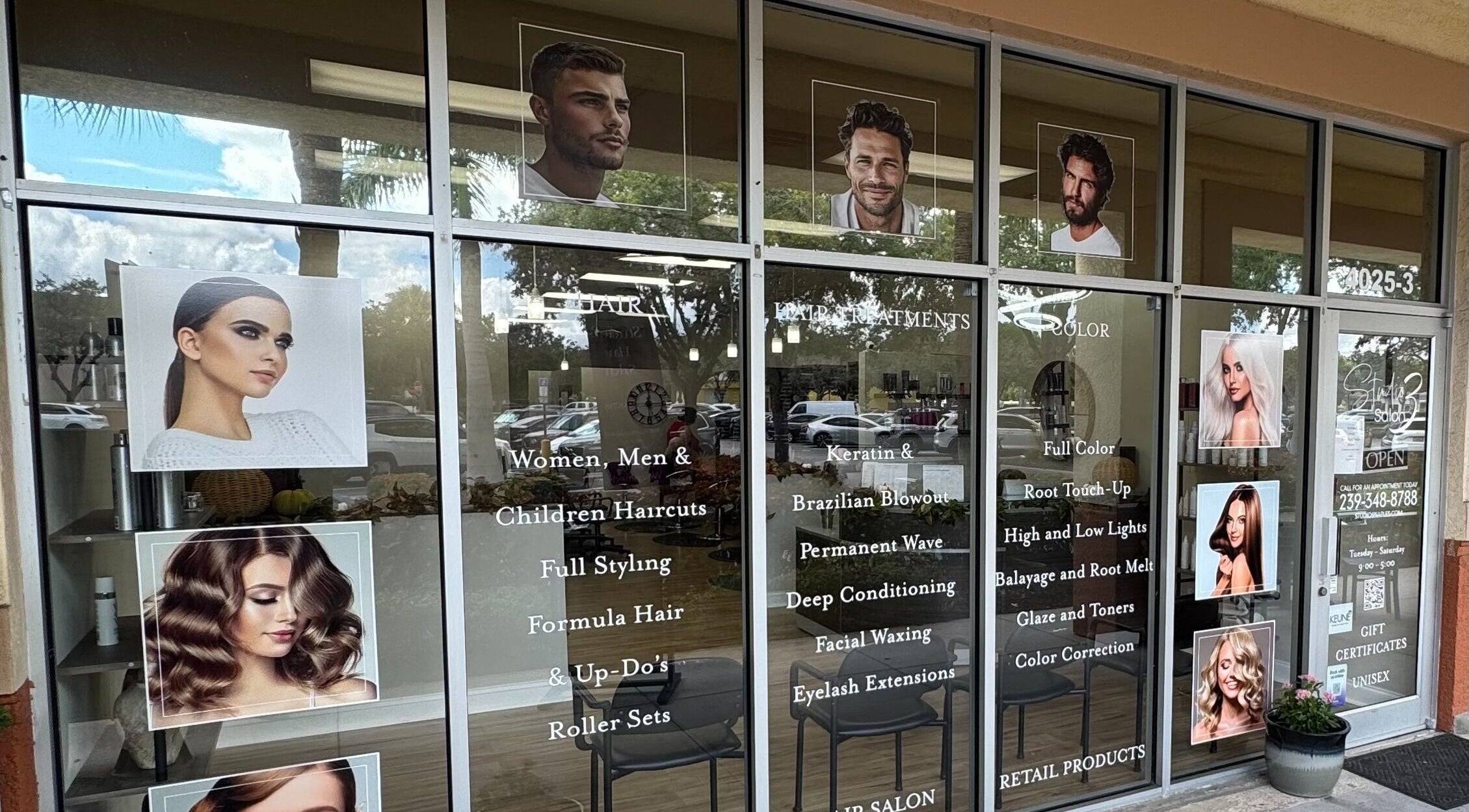 Studio 3 window display in Naples, Florida, US showcasing salon services and trendy hairstyles.