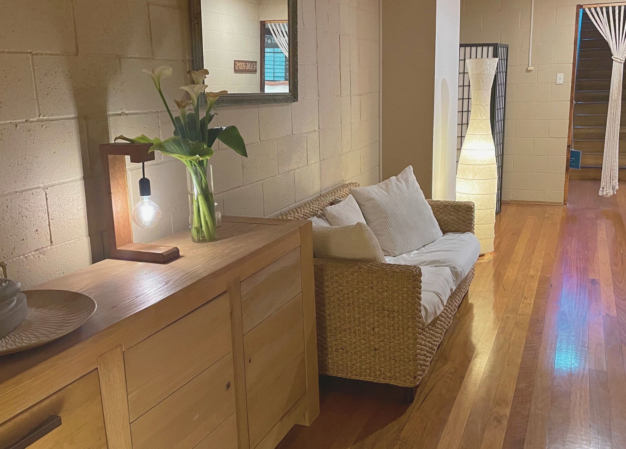 Cozy seating area at Heart and Soul Wellness Centre, Otford, New South Wales, AU with warm lighting and decor.