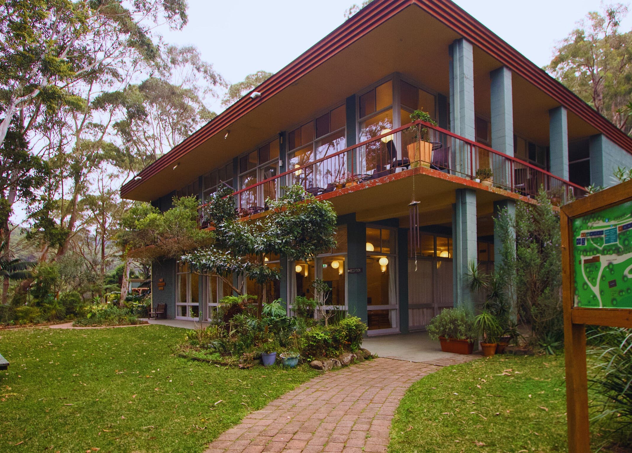Exterior view of Heart and Soul Wellness Centre in Otford, New South Wales, AU amid lush greenery.