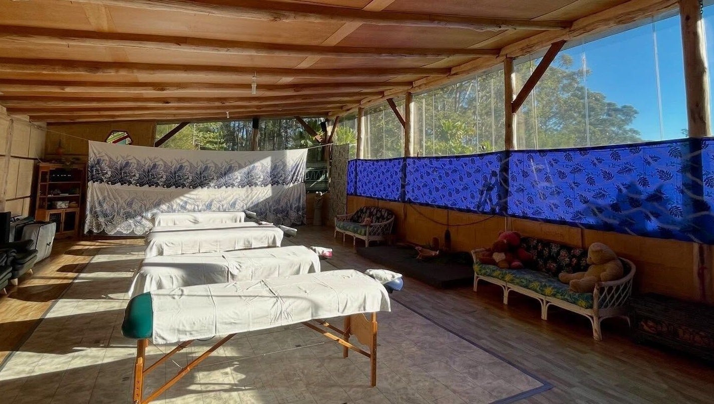 Tranquil massage area at Cosmic Rose, Newport, New South Wales, AU, with natural light and soothing decor.