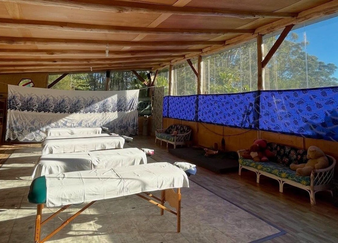 Tranquil massage area at Cosmic Rose, Newport, New South Wales, AU, with natural light and soothing decor.
