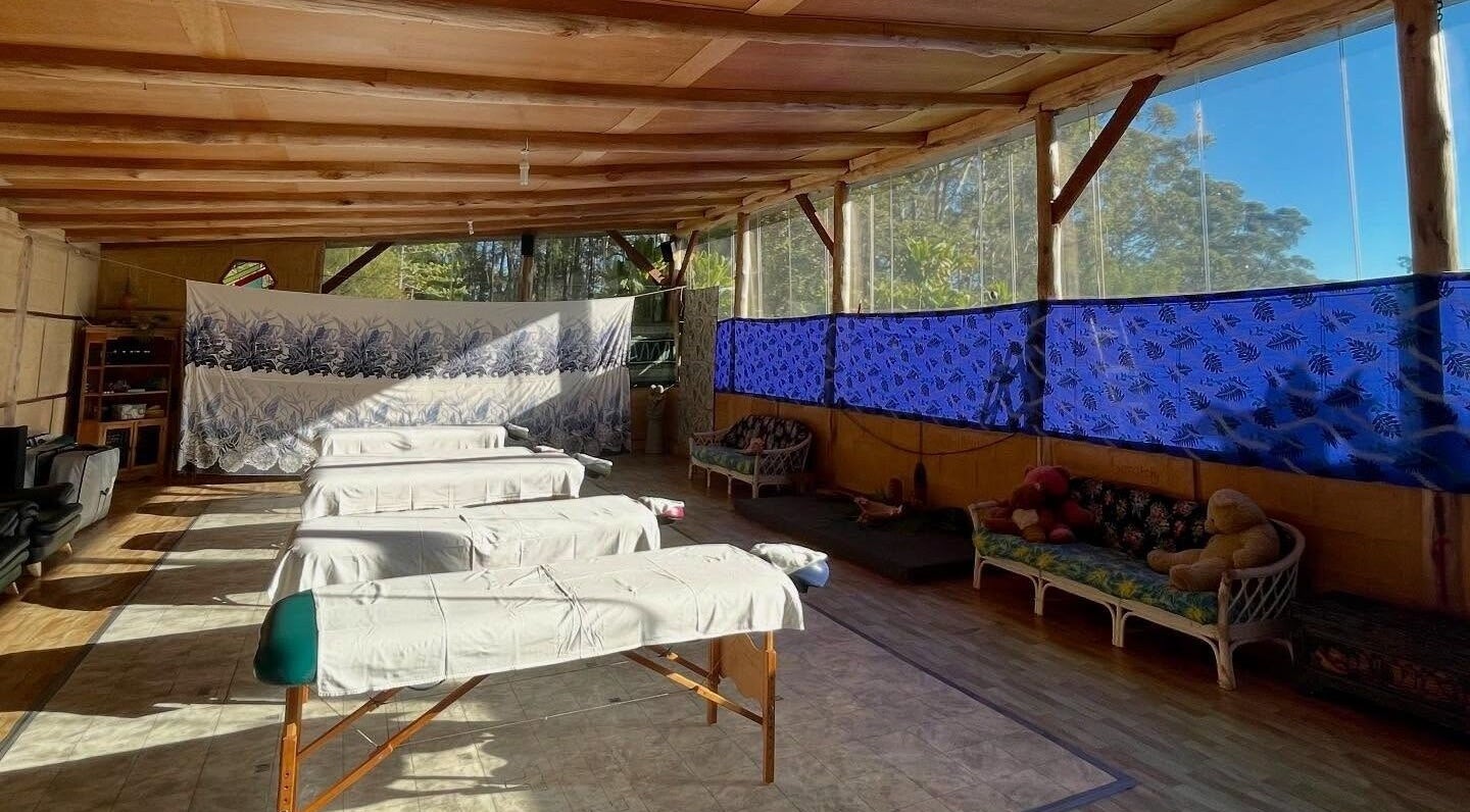 Tranquil massage area at Cosmic Rose, Newport, New South Wales, AU, with natural light and soothing decor.