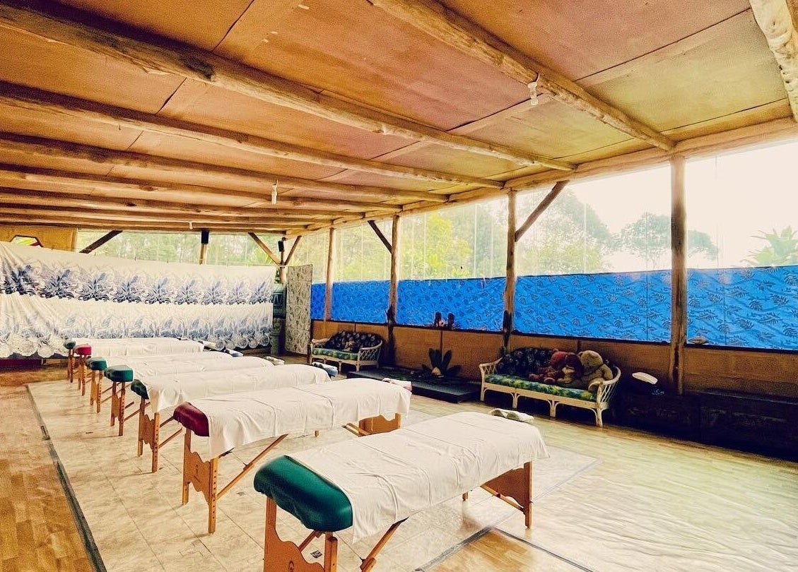 Peaceful massage tables at Cosmic Rose, Newport, NSW, AU. A serene, blue-accented wellness space awaits.