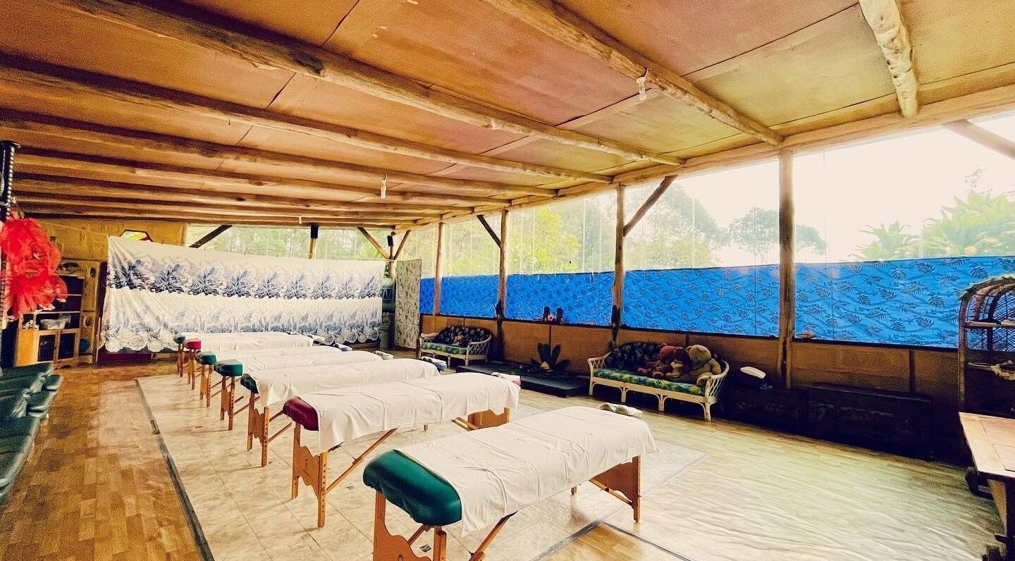 Peaceful massage tables at Cosmic Rose, Newport, NSW, AU. A serene, blue-accented wellness space awaits.