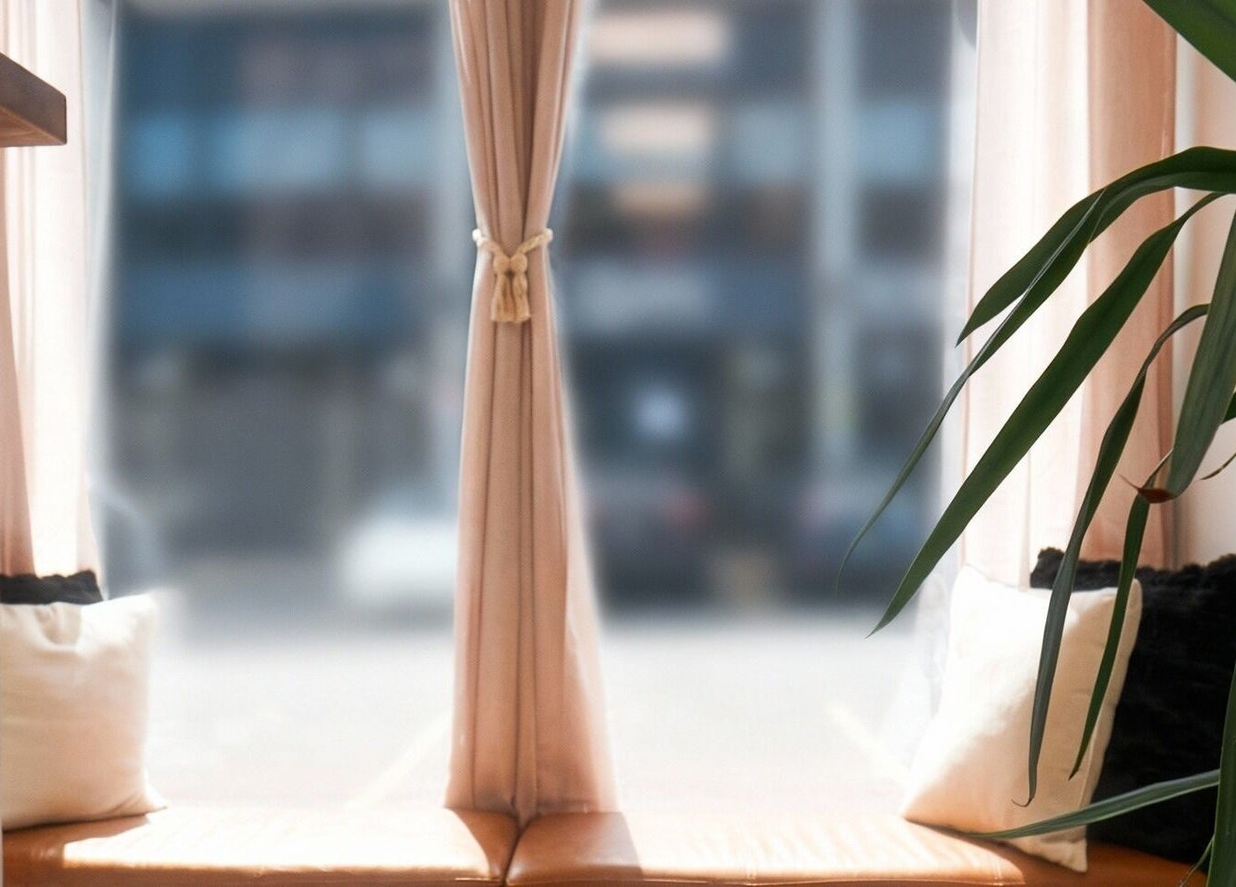 Inviting seating by a sunlit window at Nova Wax Bar Ltd., Ottawa, Ontario, CA, offering a peaceful ambiance.