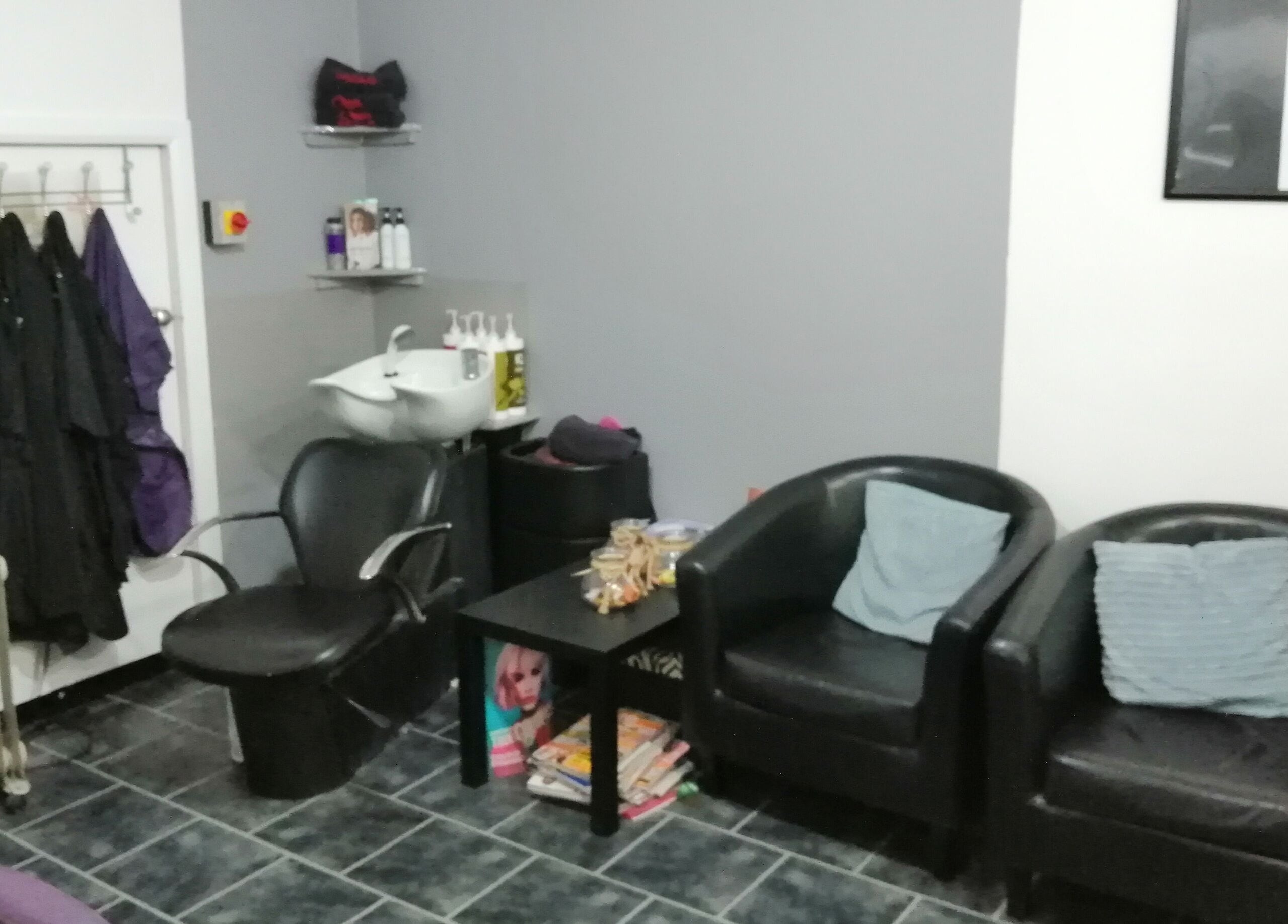 Seating area at Mel at Salon Arriba, Stoke-on-Trent, England, GB showcasing modern chairs and salon essentials.
