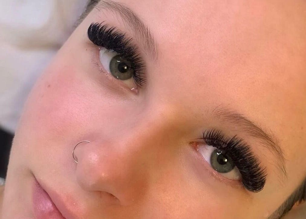 Close-up of eyelash extensions at CJL Lashes, Bognor Regis, England, GB, enhancing green eyes beautifully.