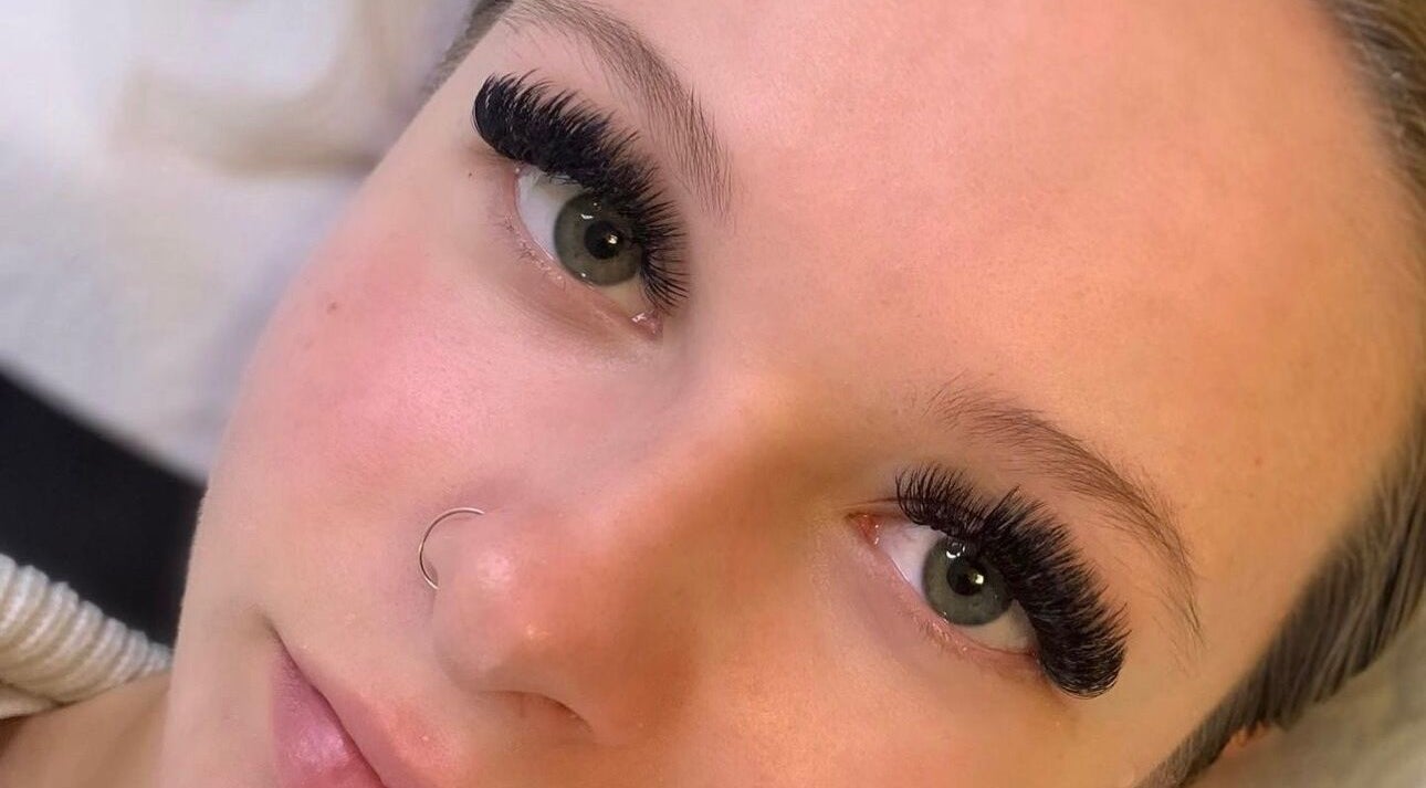 Close-up of eyelash extensions at CJL Lashes, Bognor Regis, England, GB, enhancing green eyes beautifully.