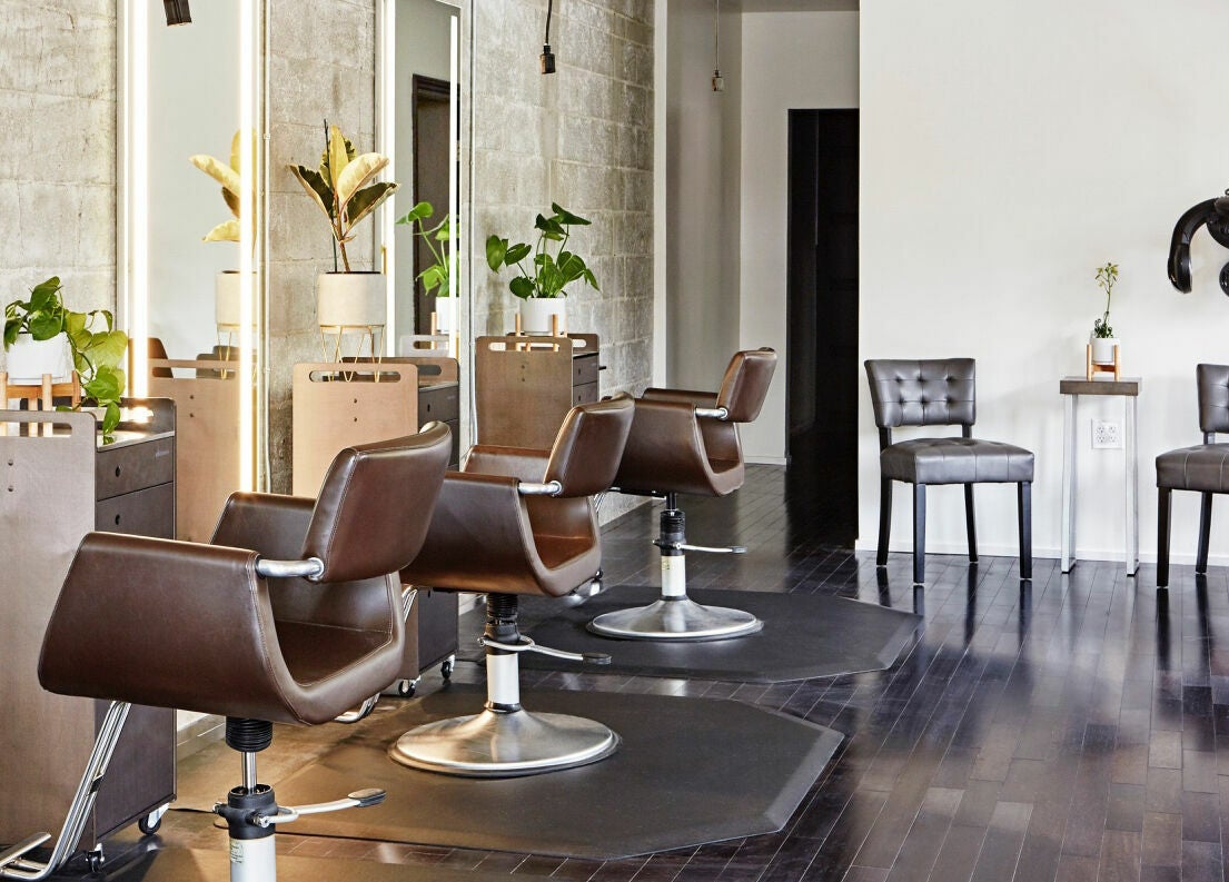 Elegant interior of Wavelength Salon in Los Gatos, California, US with modern styling chairs and decor.