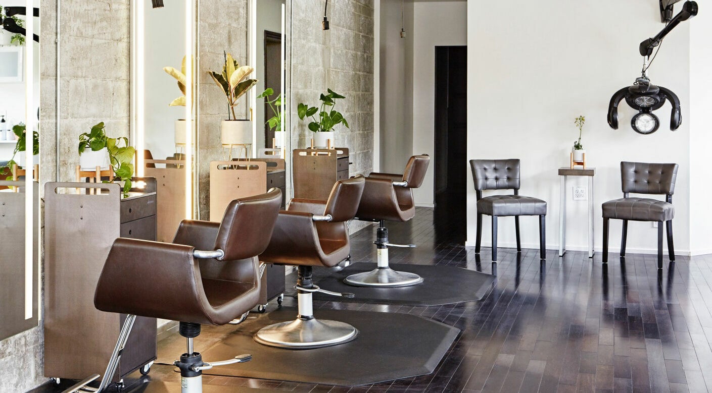 Elegant interior of Wavelength Salon in Los Gatos, California, US with modern styling chairs and decor.