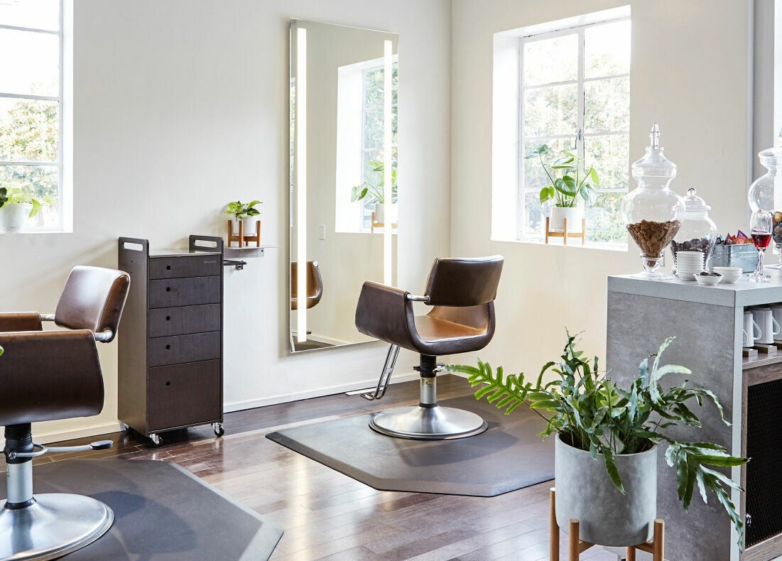 Elegant styling area at Wavelength Salon in Los Gatos, California, US, featuring modern chairs and refreshments.