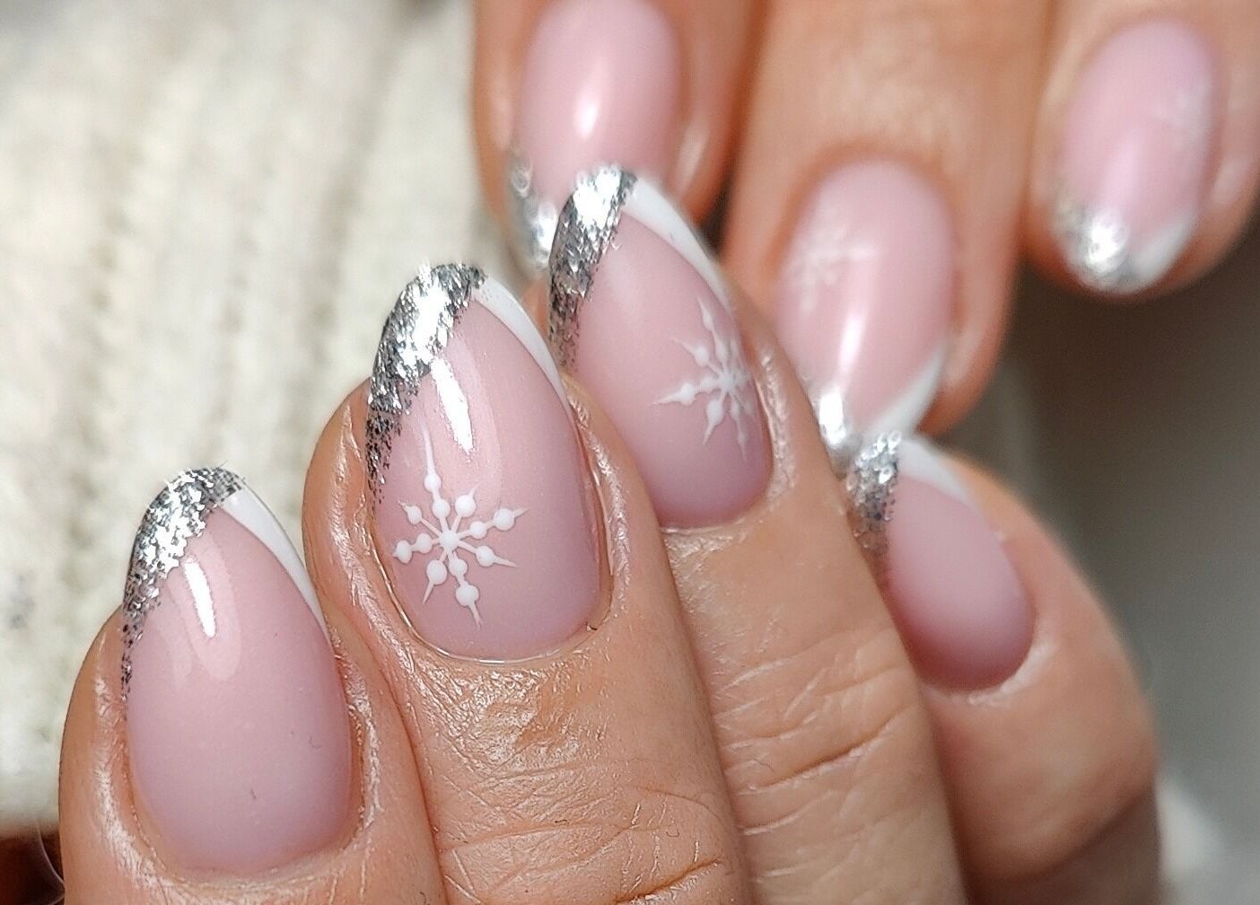Elegant snowflake nail art with silver tips at Kala Nails Limerick, Limerick, County Limerick, IE.