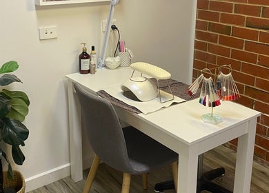 Elegant nail station at MKT Beauty in Kerang, Victoria, AU, showcasing modern design and nail polish display.