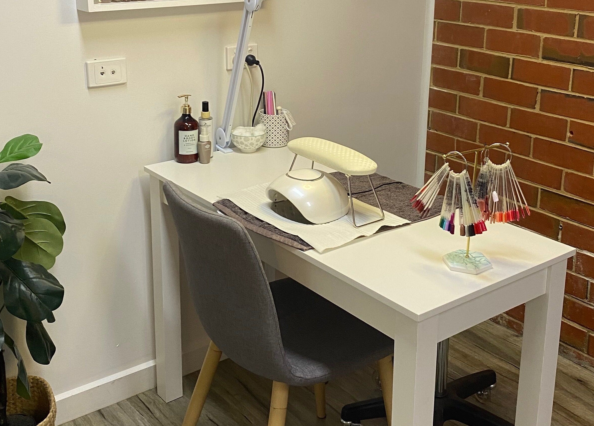 Elegant nail station at MKT Beauty in Kerang, Victoria, AU, showcasing modern design and nail polish display.