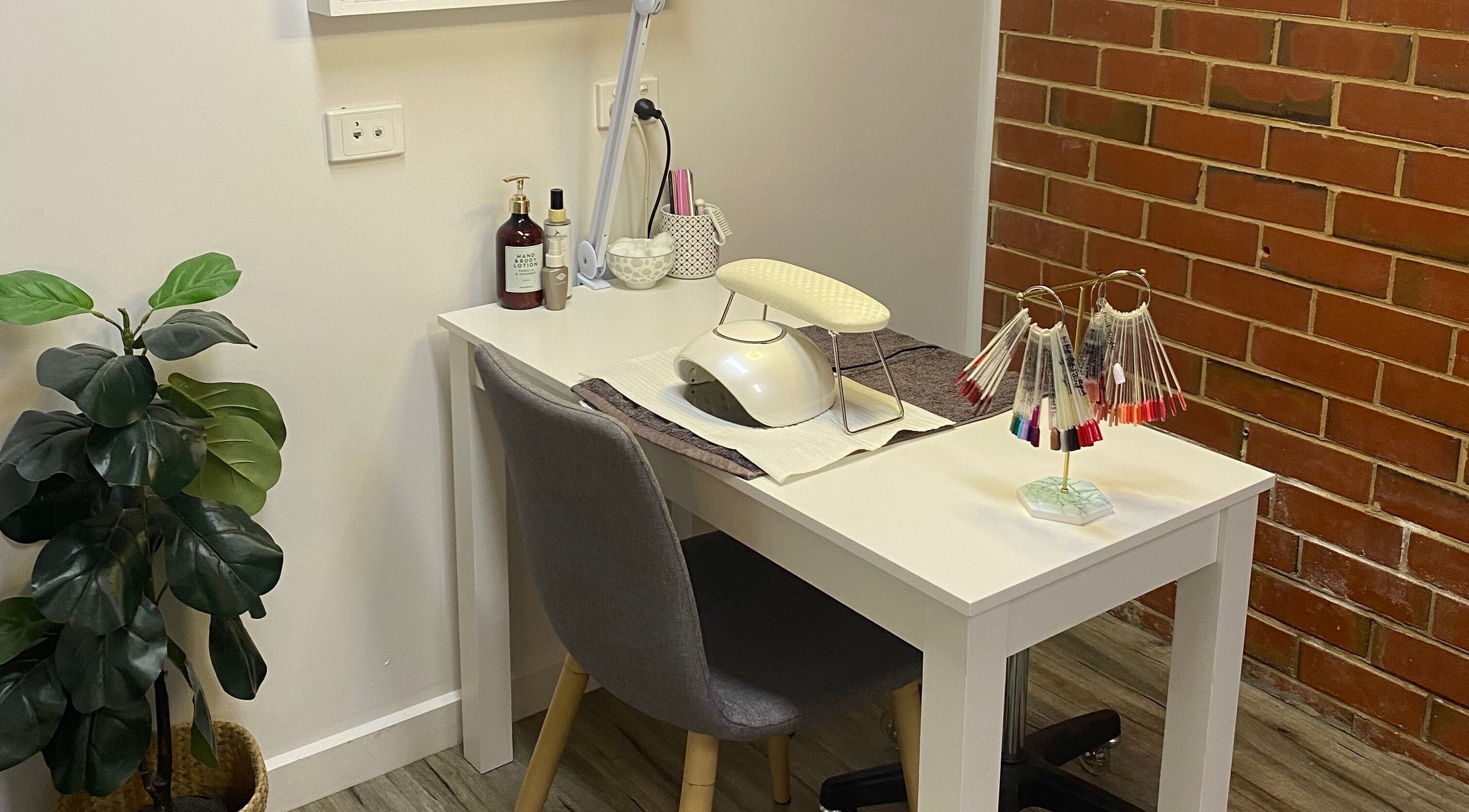 Elegant nail station at MKT Beauty in Kerang, Victoria, AU, showcasing modern design and nail polish display.
