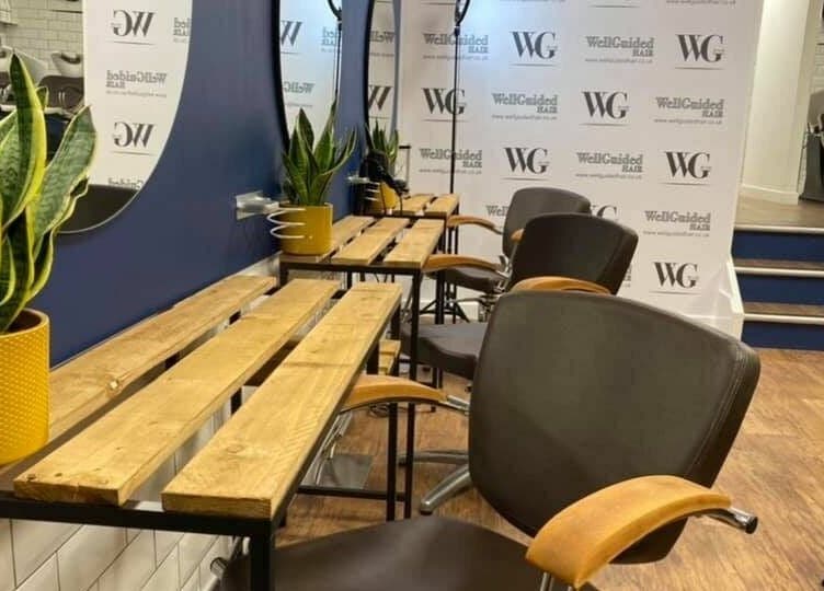 Stylish salon seating at Well Guided Hair, Torquay, England, GB with modern decor and elegant fixtures.