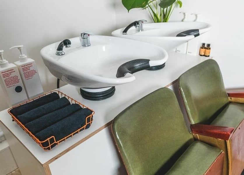 Elegant washing station at Cuts and Creps, Bristol, England, GB, showcasing modern comfort and style.