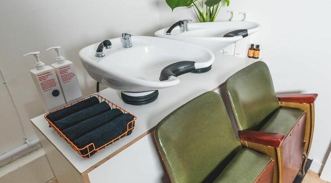 Elegant washing station at Cuts and Creps, Bristol, England, GB, showcasing modern comfort and style.