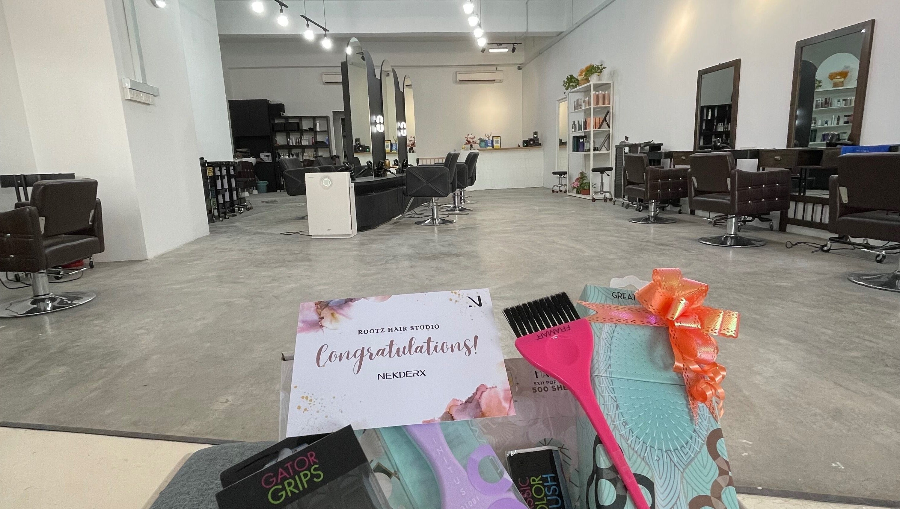 Modern interior of Rootz Hair Studio in Petaling Jaya, Selangor, MY featuring stylish chairs and decor.