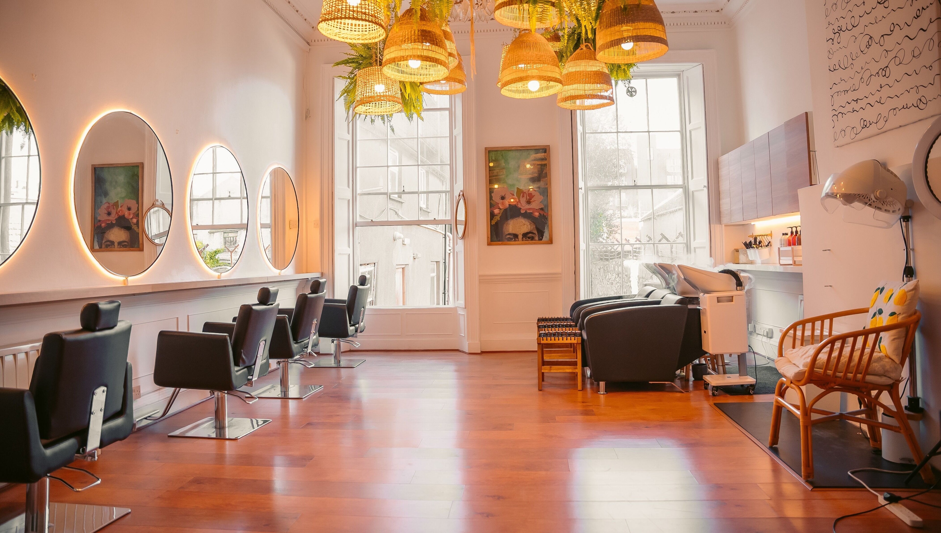 Bright interior of Gabriela Leite Curly Hair Salon in Dublin with elegant seating and stylish decor.