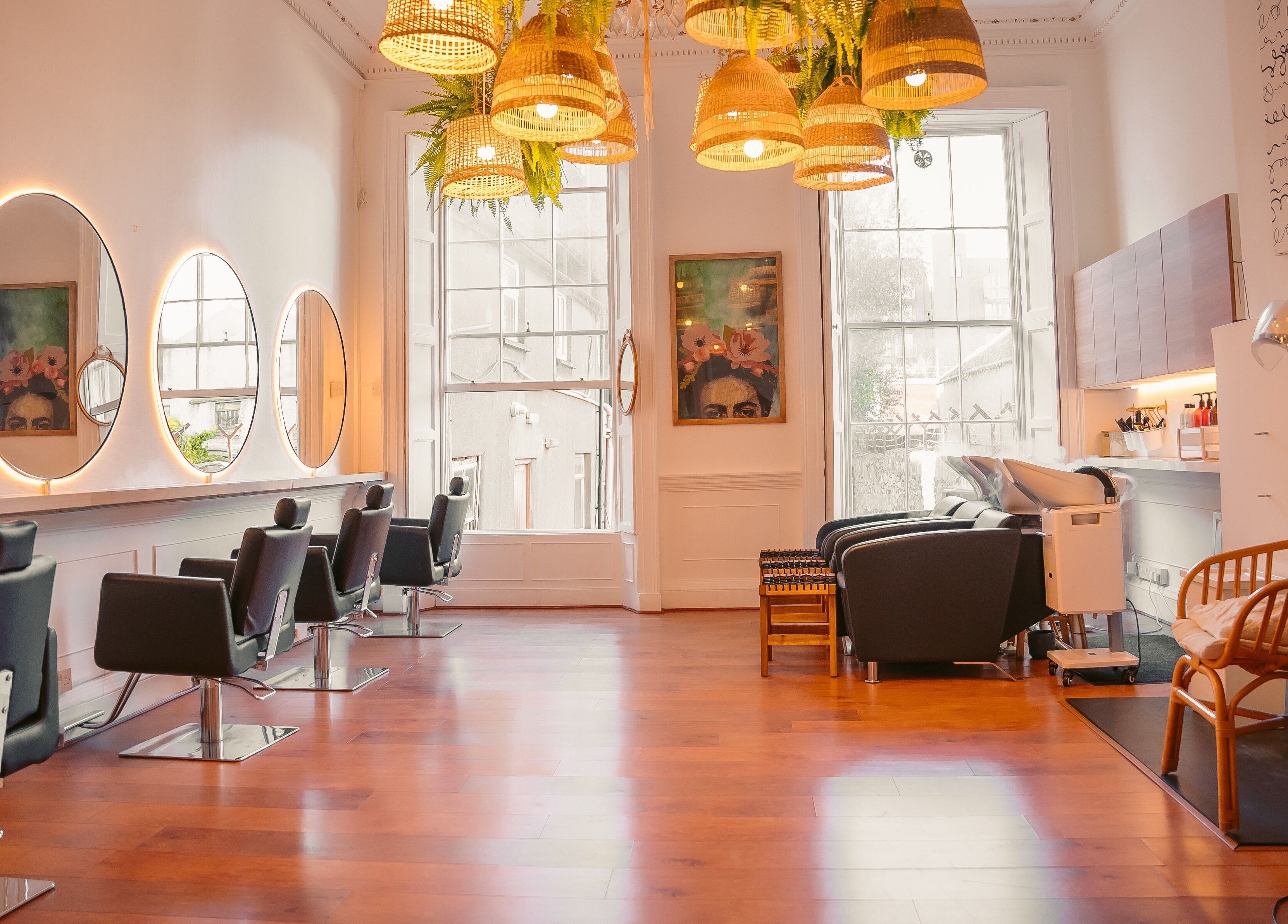 Bright interior of Gabriela Leite Curly Hair Salon in Dublin with elegant seating and stylish decor.