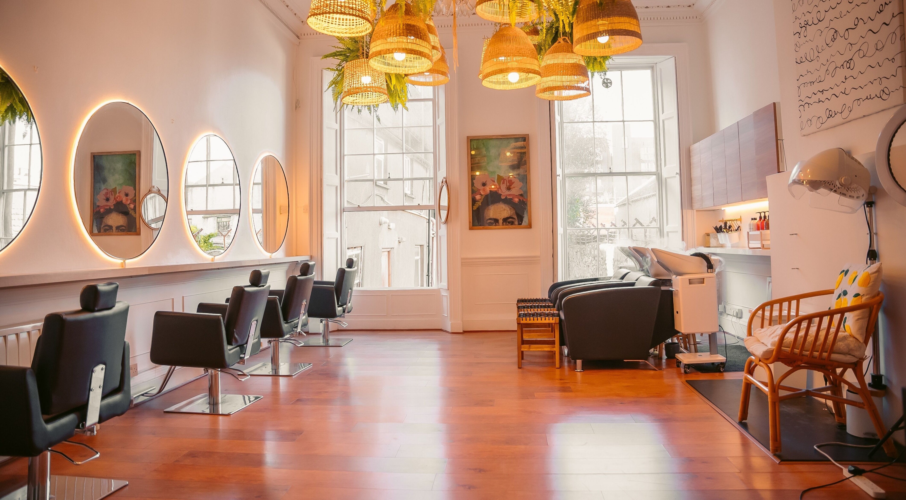 Bright interior of Gabriela Leite Curly Hair Salon in Dublin with elegant seating and stylish decor.