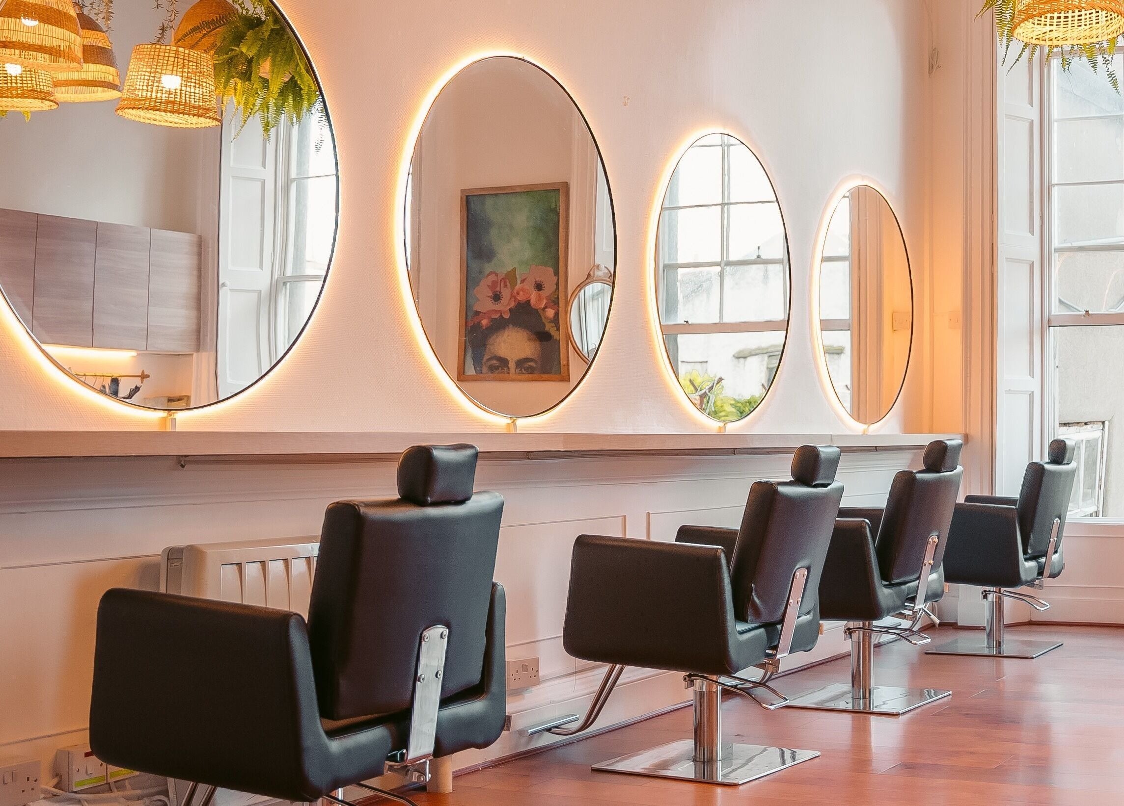 Interior of Gabriela Leite Curly Hair Salon, Dublin, with stylish mirrors and modern chairs, County Dublin, IE.
