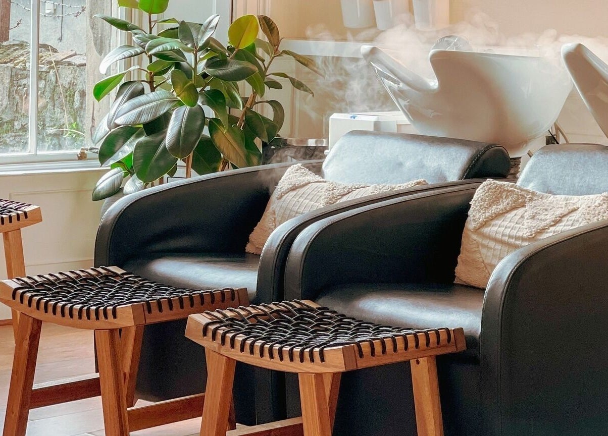 Comfortable seating at Gabriela Leite Curly Hair Salon, Dublin, County Dublin, IE with lush green plants.